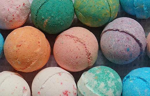 Close up of bath bombs of various colors