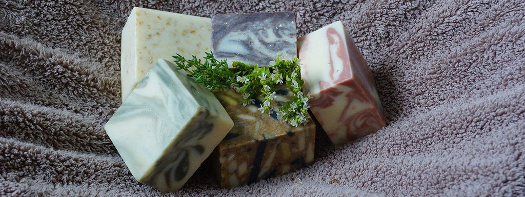 Block marbled soaps on a towel