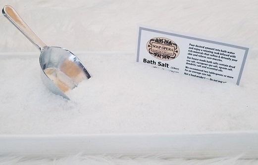 Dish of bath salts with a scoop